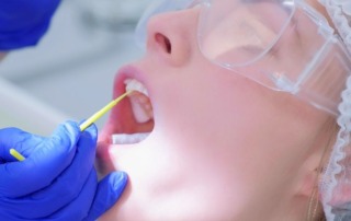 a patient getting fluoride during a dental visit